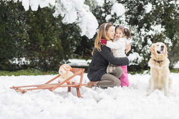 Wall Mural - Family with a dog at winter