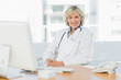 © WavebreakmediaMicro - Female doctor sitting with computer at medical office