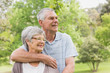 © WavebreakMediaMicro - Senior man embracing woman from behind at park