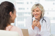 © WavebreakmediaMicro - Friendly female doctor in conversation with patient