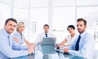 Wall Mural - Executives sitting around conference table