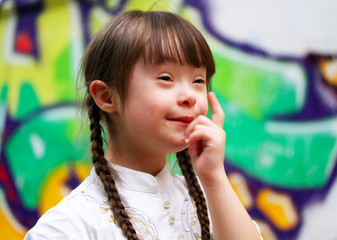 Wall Mural - Portrait of beautiful young girl on the playground.