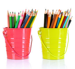 Colorful pencils in two pails isolated on white