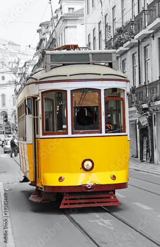 Fototapeta na wymiar Old yellow tram in Lisbon