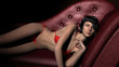 © Riko Best - beautiful girl posing in red bikini on a sofa