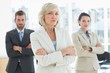 © WavebreakmediaMicro - Confident business team with arms crossed in office