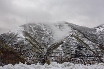 mountain peak with low clouds