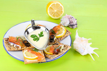 Sticker - Salmon sandwiches on plate  on wooden table close-up