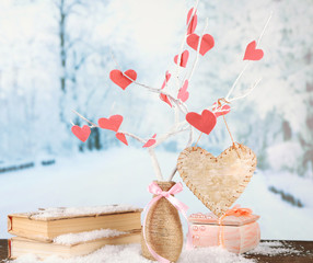 Wall Mural - Decorative branch with hearts, on winter background