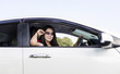 © Sasint - Young woman in her new car smiling