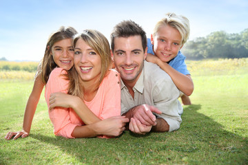 Wall Mural - Portrait of happy family in summer time