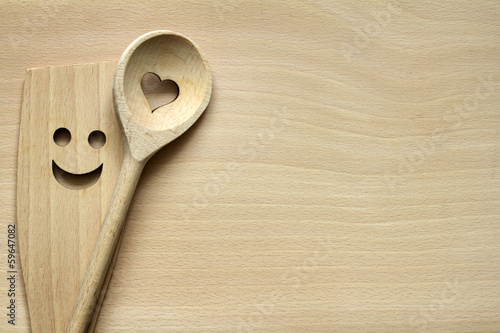 Fotografía Wooden kitchenware on cutting board abstract food background