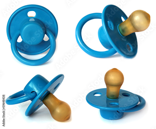 Fotografija  Set Blue baby's dummy isolated on white