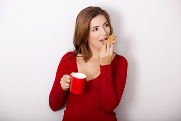 Poster - Woman drinking coffee with cookies