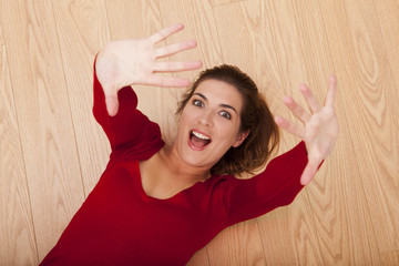 Wall Mural - Woman lying on the floor