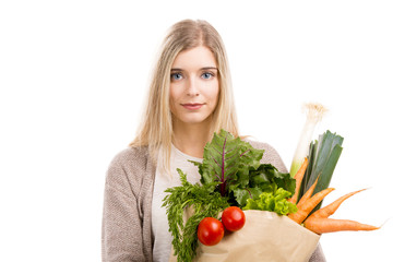 Wall Mural - Beautiful woman carrying vegetables