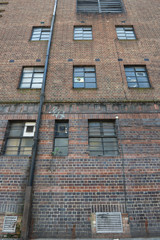 Classic brick wall with glass windows