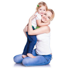 closeup portrait of young mother hug her little daughter