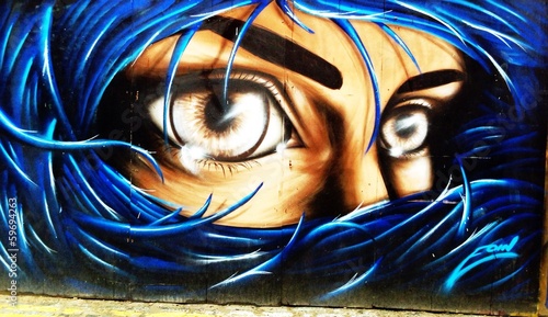 Obraz w ramie graffiti portrait of a woman with blue hair on Londons streets