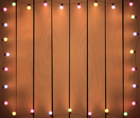 Wall Mural - christmas lights on wooden background