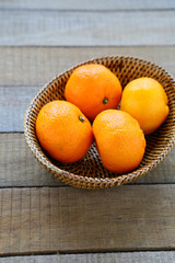 Wall Mural - whole tangerines in basket