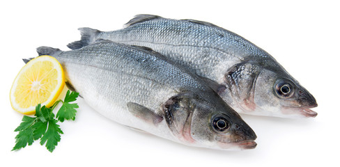 Fresh seabass with slice of lemon and parsley isolated