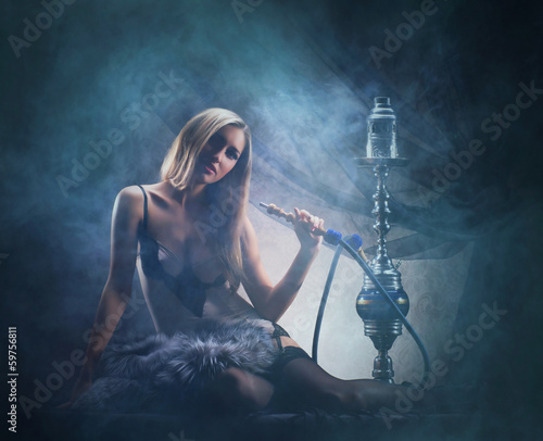 Foto-Fahne - A sexy woman in luxury underwear smoking the hookah (von Acronym)