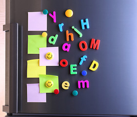 Wall Mural - Empty paper sheets and colorful magnets on fridge door