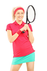 Wall Mural - Young smiling female posing with a tennis racket