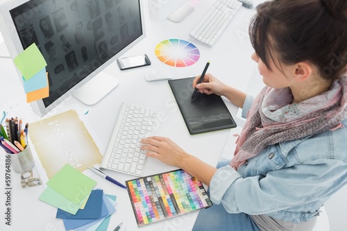 Fotografie, Obraz Artist drawing something on graphic tablet at office