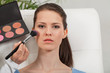 © juniart - junge attraktive frau wird geschminkt im salon rouge