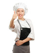 © shefkate - Attractive cook woman showing ok over white background.