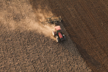 aerial view of harvest fields with tractor