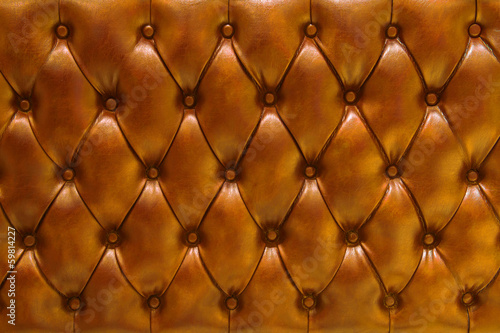 Board z aluminiowym obramowaniem Naturalny pikowany skórzany tekstura tło w orange