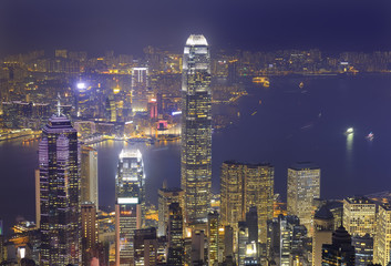 Hong Kong city skyline panorama at night with Victoria Harbor an