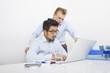 © MDBPIXS - Businessmen using laptop together at desk in office
