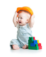 kid playing with building blocks toy