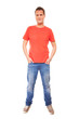© Voyagerix - Young man guy red t-shirt jaens with hands in pockets isolated