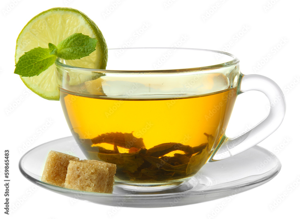 Transparent cup of green tea with lime and sugar isolated
