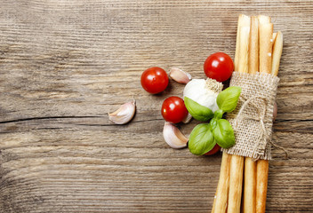 Canvas Print - Traditional italian breadsticks on wooden background. Top view,