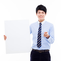 Wall Mural - Young Asian business man holding a blank banner