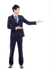 Wall Mural - Young Asian business man showing something