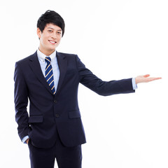 Canvas Print - Young Asian business man showing something