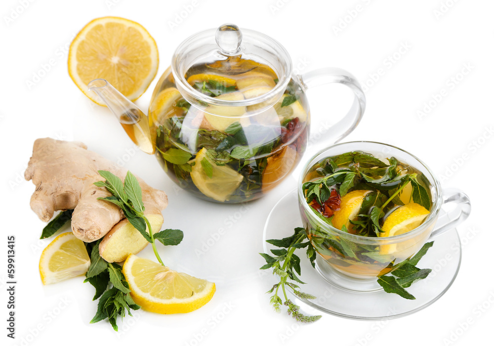 Kettle and cup of tea with ginger isolated on white