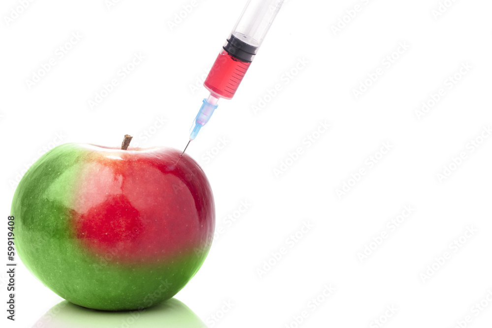 Apple in two colors with a syringe. Concept for GMO. - obrazy, fototapety, plakaty 