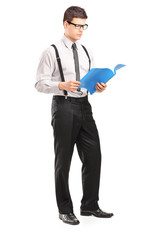 Poster - Full length portrait of young man reading papers