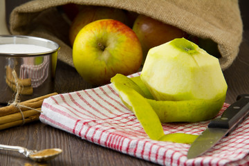 Wall Mural - Peeled apple with ingredients for an apple pie