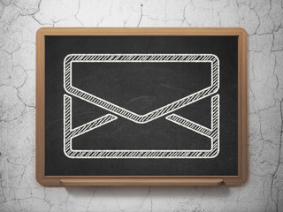 Finance concept: Email on chalkboard background