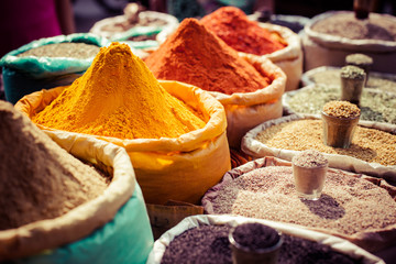 Poster - Indian colored spices at local market.