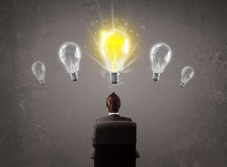 Business person having an idea light bulb concept